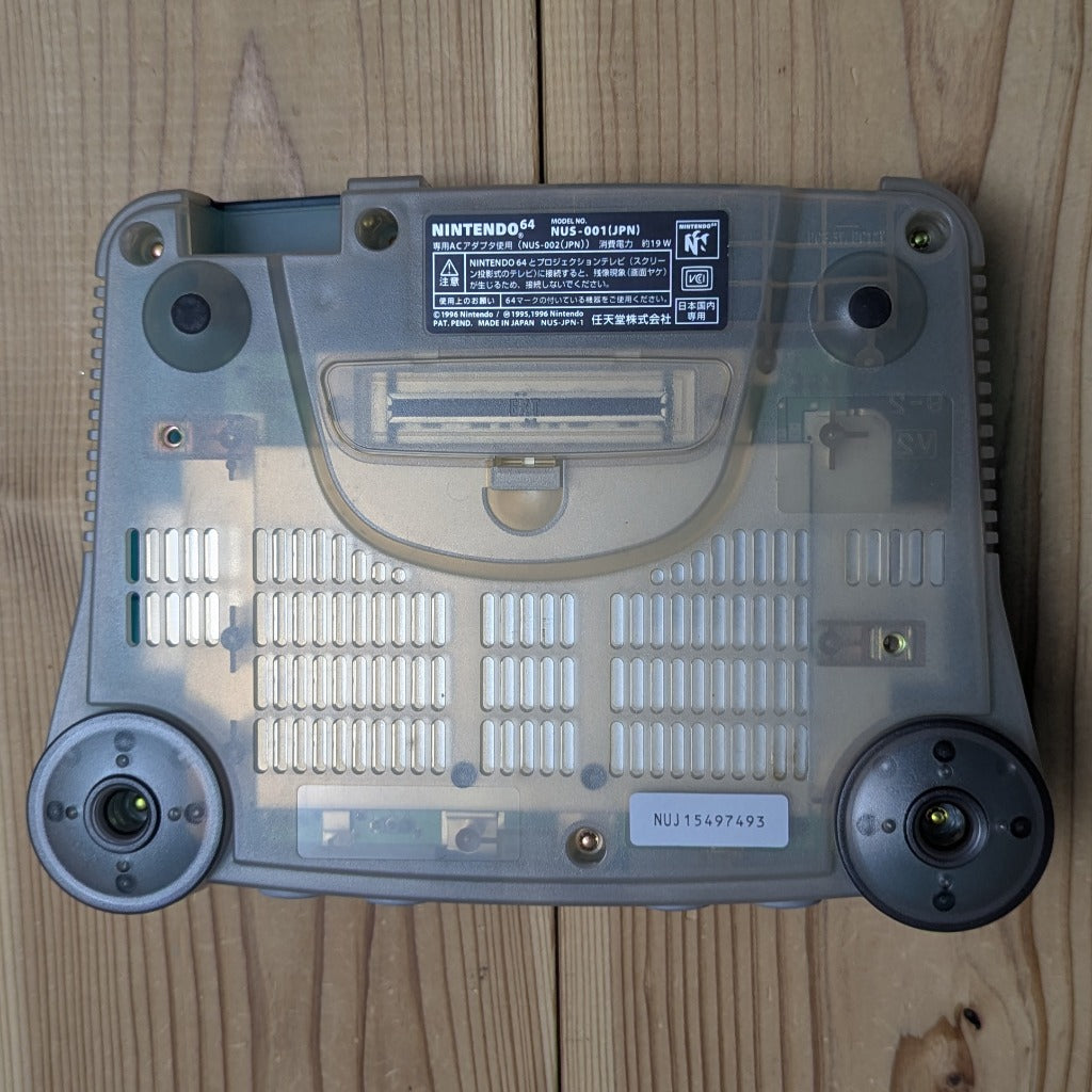 Bottom base of Nintendo 64 Clear Blue console NUS-001 showing authentic serial number sticker NUJ15497493