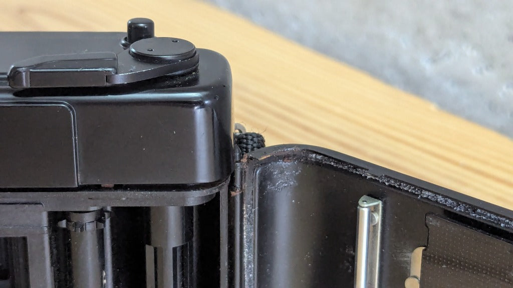 Yashica Auto Focus close-up of film door hinge and degraded rubber light seals