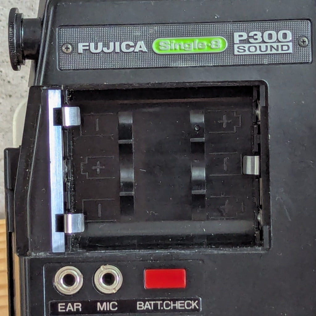 Fujica Single-8 Sound P300 open battery compartment with clean silver contacts