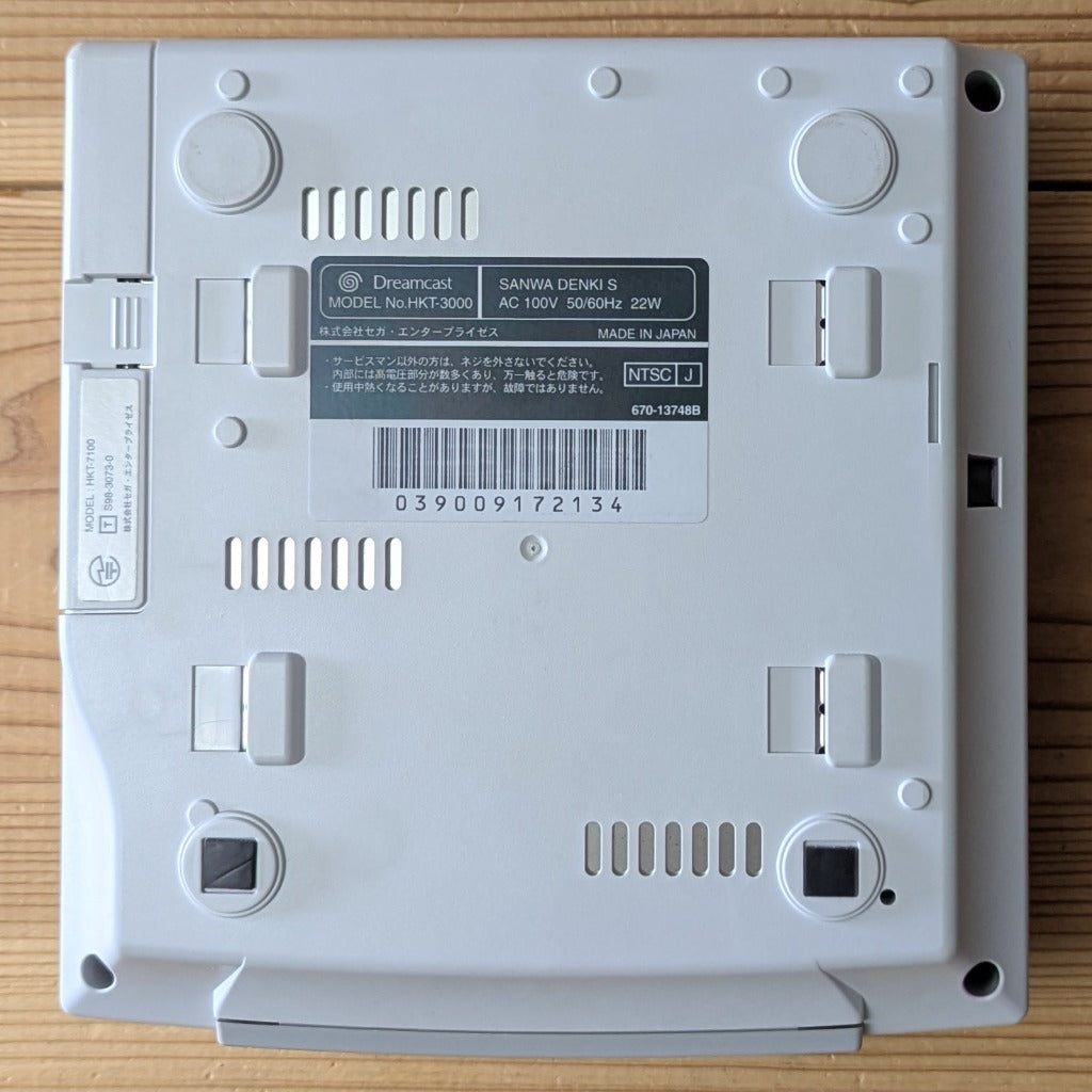 Sega Dreamcast console bottom label Model HKT-3000 serial 039009172134 and HKT-7100 modem