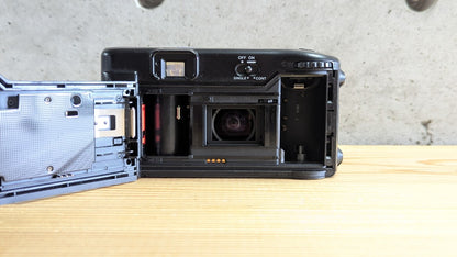 Olympus AZ-1 Zoom open film chamber showing clean motorized spool and lens element