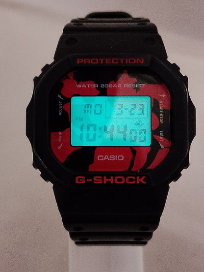 Casio G-Shock DW-5600JK-1 Nishikigoi edition with red and black pattern front view with light