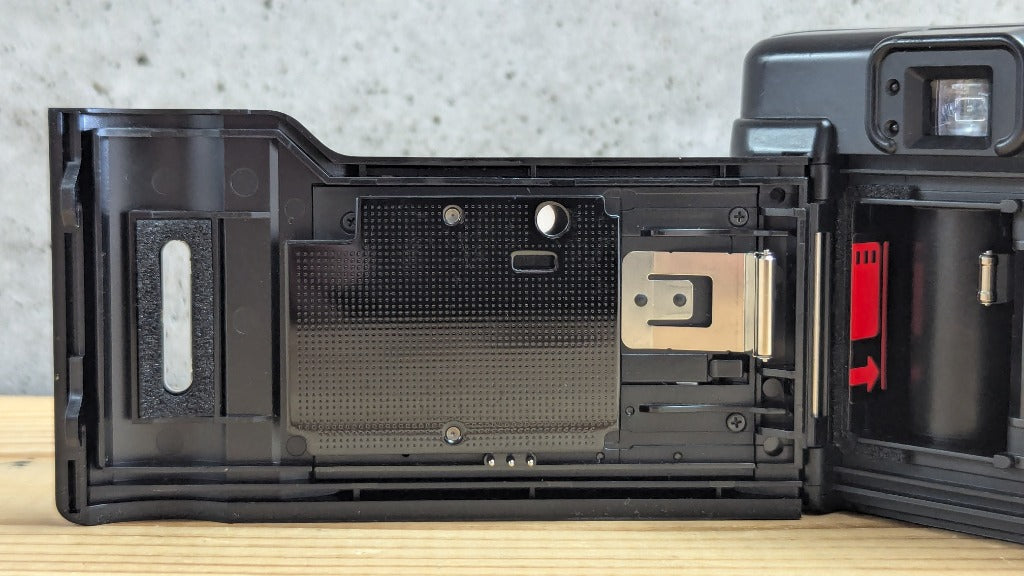 Olympus AZ-1 Zoom open back door showing pressure plate and cartridge chamber