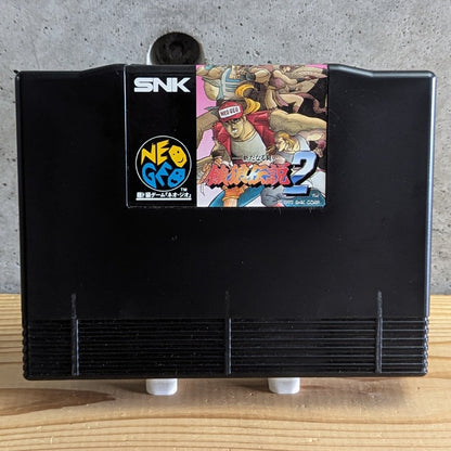 Garou Densetsu 2 Fatal Fury 2 Neo Geo AES official ROM cartridge front view on stand with original glossy label