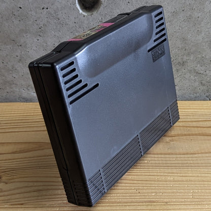 Angled rear perspective of Fatal Fury 2 Neo Geo AES cartridge on stand highlighting clean corner moldings