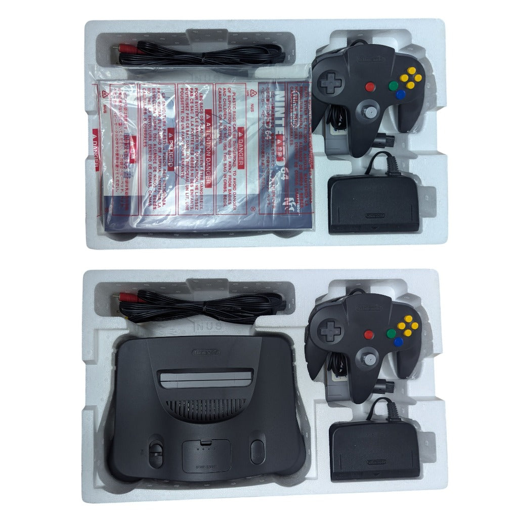 Original styrofoam inner tray packaging layers showing console controller cables and manual in protective bag