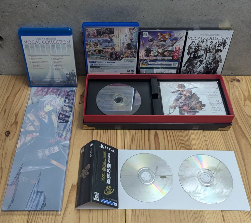 Rear view of game case and 15th Anniversary Vocal Collection 2-CD Discs showing pristine mirror surface