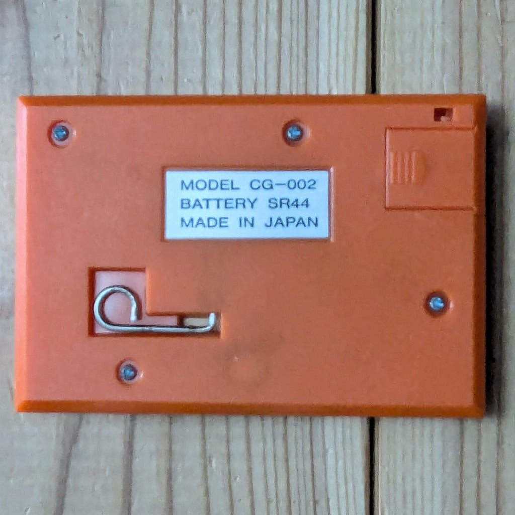 Q&Q Model CG-002 Battery SR44 Made in Japan Label and Kickstand Detail