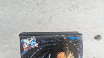 Detailed condition close-up of top edge of Shin Samurai Spirits Neo Geo AES clamshell case showing original paper insert