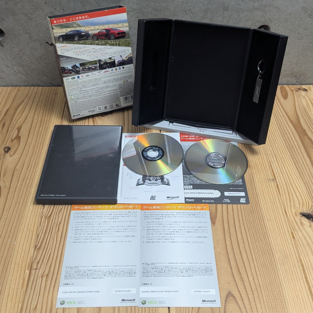 Forza Motorsport 3 Limited Edition Trifold Presentation Box showing Official Metal Keychain and 2 Clean Discs